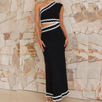 Black one-shoulder sleeveless maxi dress with zigzag trim along shoulder and hem