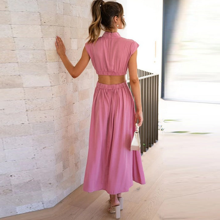 Pink sleeveless midi dress with high back, gathered waist and pleated skirt