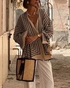 Clara™ elegant blouse, cream fabric with black geometric stripes, open V-neck, long sleeves