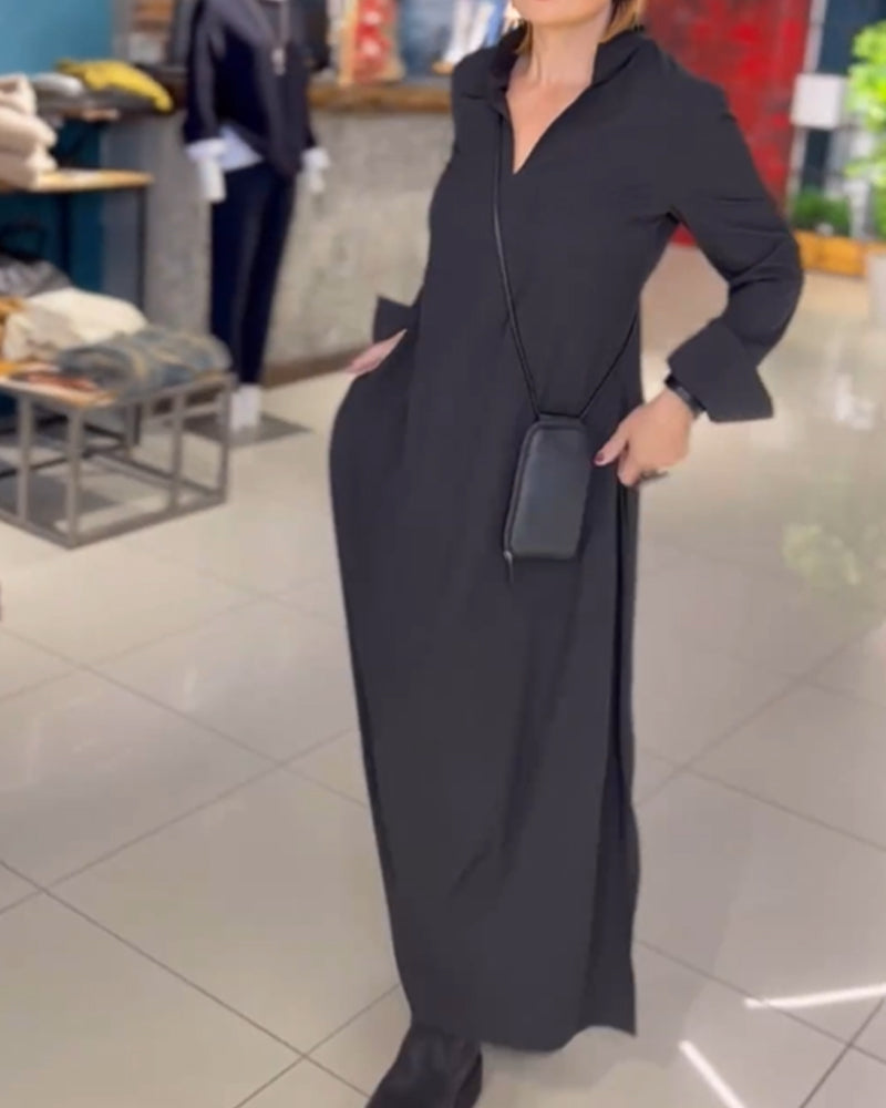 Black V-neck maxi dress with three-quarter sleeves and wrap-style waist, side drape.