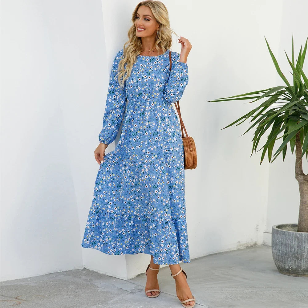 Blue daisy floral maxi dress with long sleeves, elastic waist, and midi-tiered skirt