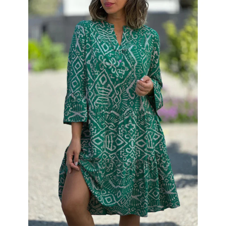 Women's summer dress in emerald green with white geometric print, V-neck, tiered hem