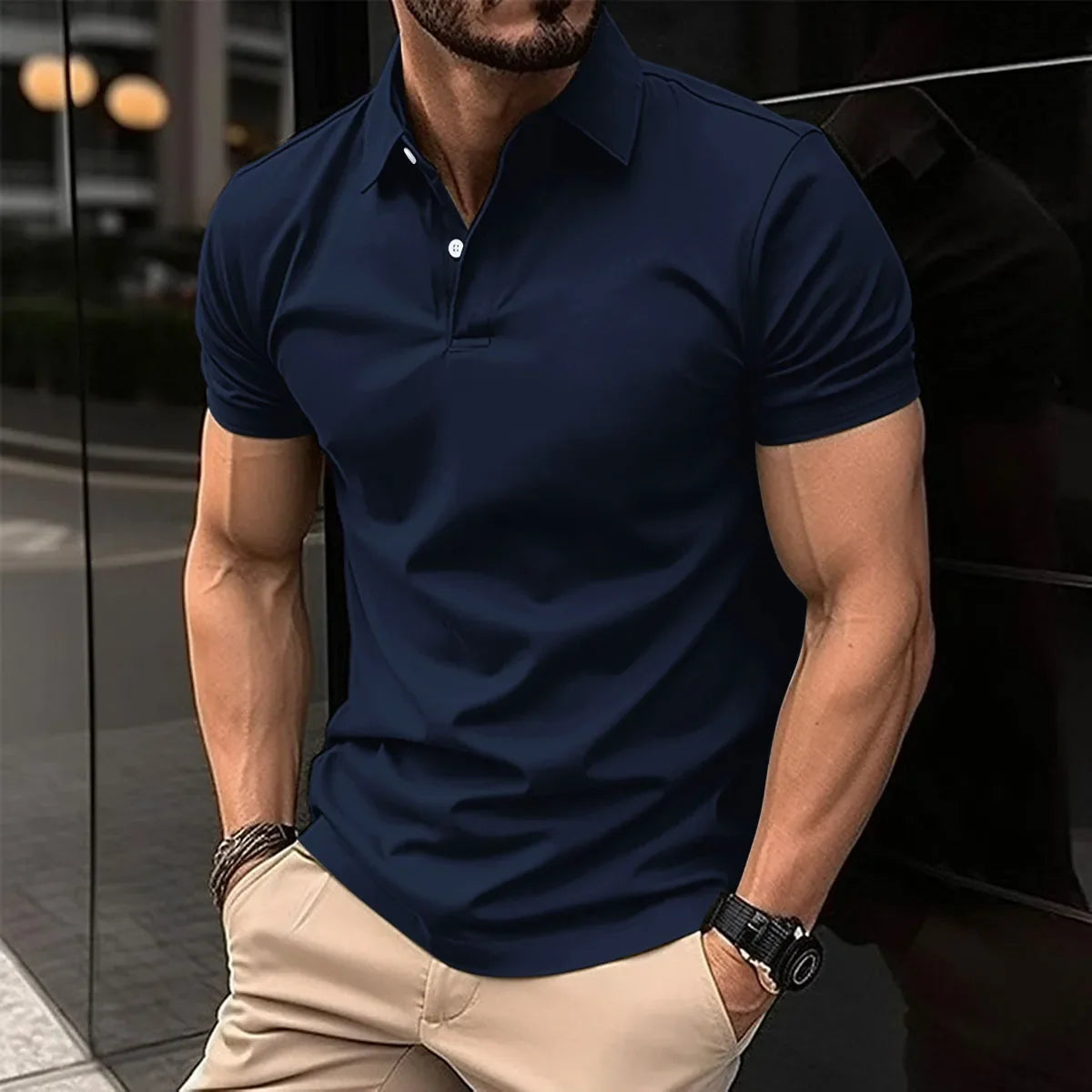 Men's navy polo shirt with collar, button placket, and short sleeves