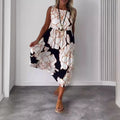 Sleeveless printed midi dress with round neckline and flowing tiered skirt, beige-brown.