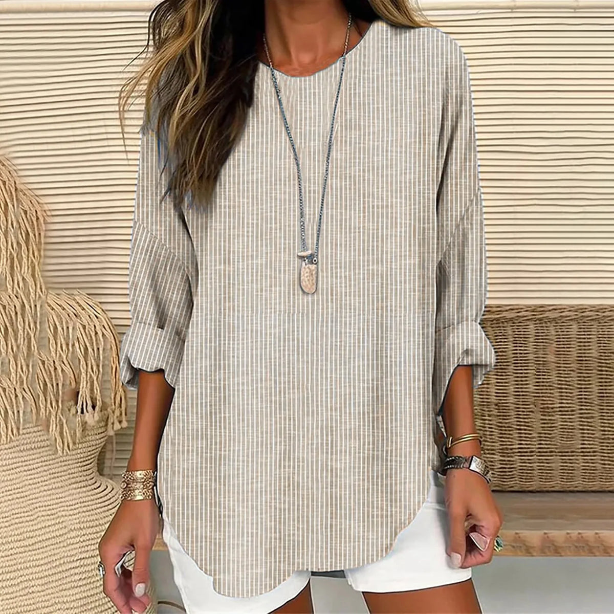 Neutral striped linen tunic top with long sleeves, round neckline, curved hem
