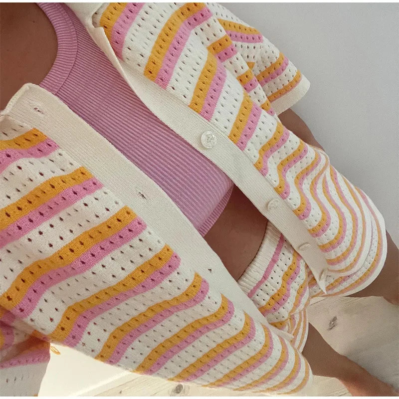 Close-up of multicolor striped knit fabric with button placket