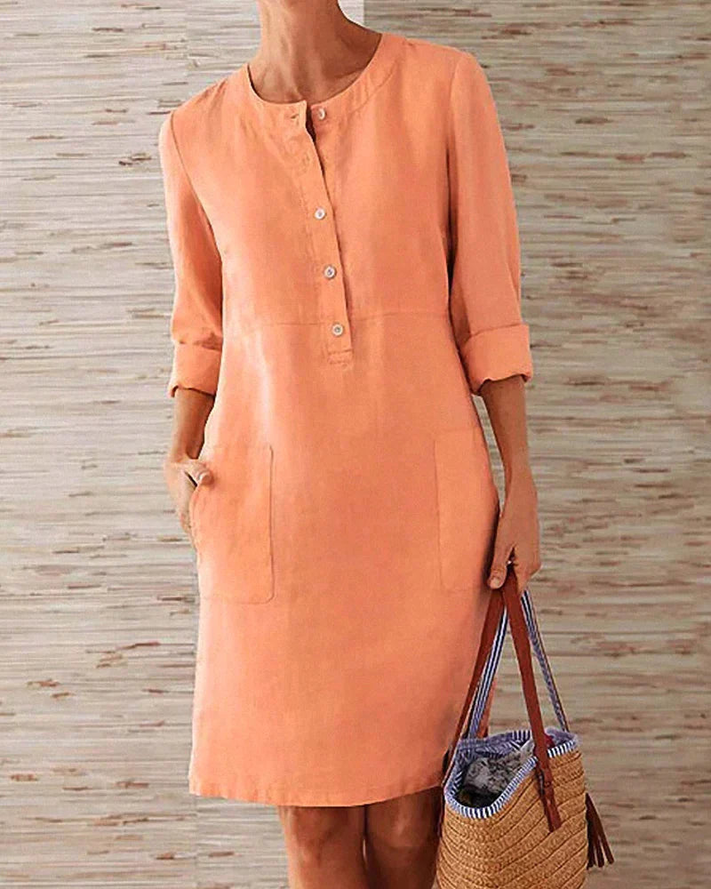 Coral orange button-front summer dress with three-quarter sleeves and side pockets