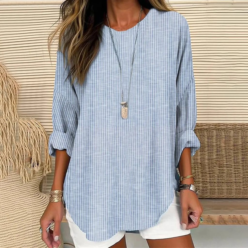 Blue striped linen tunic top with long sleeves, round neckline, curved hem