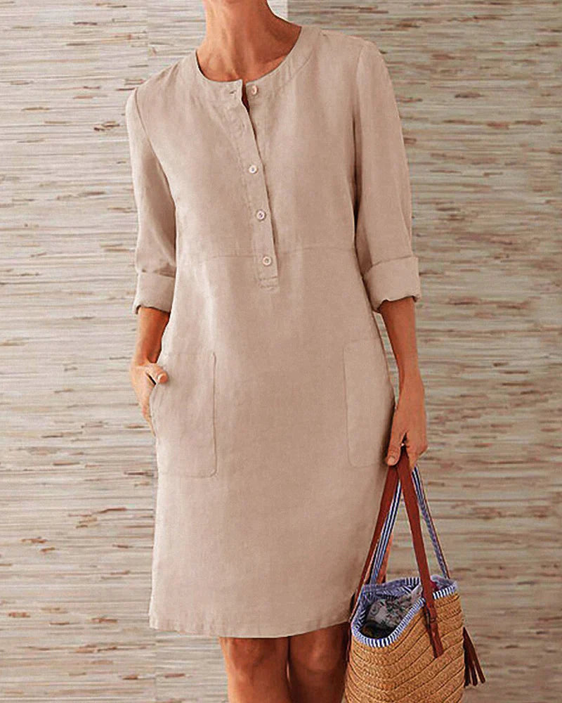 Beige button-front summer dress with three-quarter sleeves and side pockets