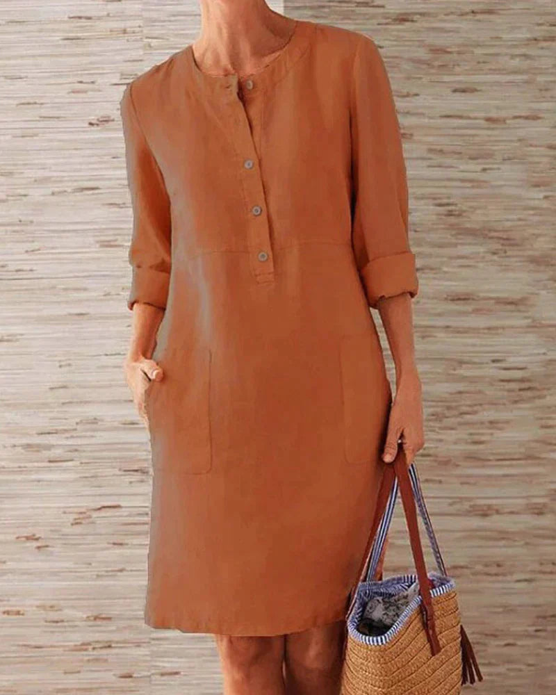 Rust orange button-front summer dress with three-quarter sleeves and side pockets