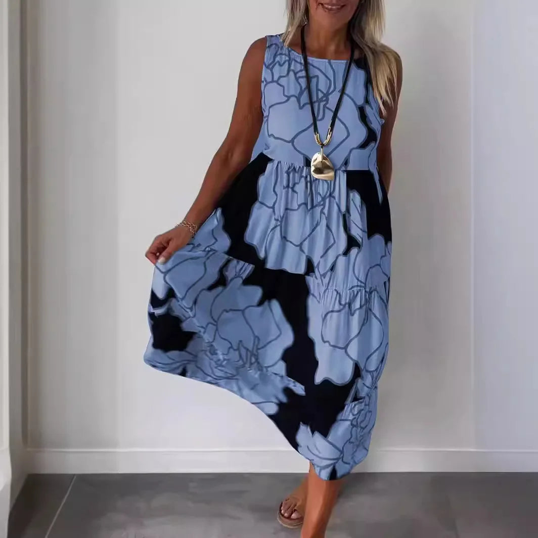 Sleeveless printed midi dress with round neckline and flowing tiered skirt, blue.