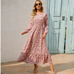 Pink floral maxi dress with long sleeves and gathered waist with tiered skirt