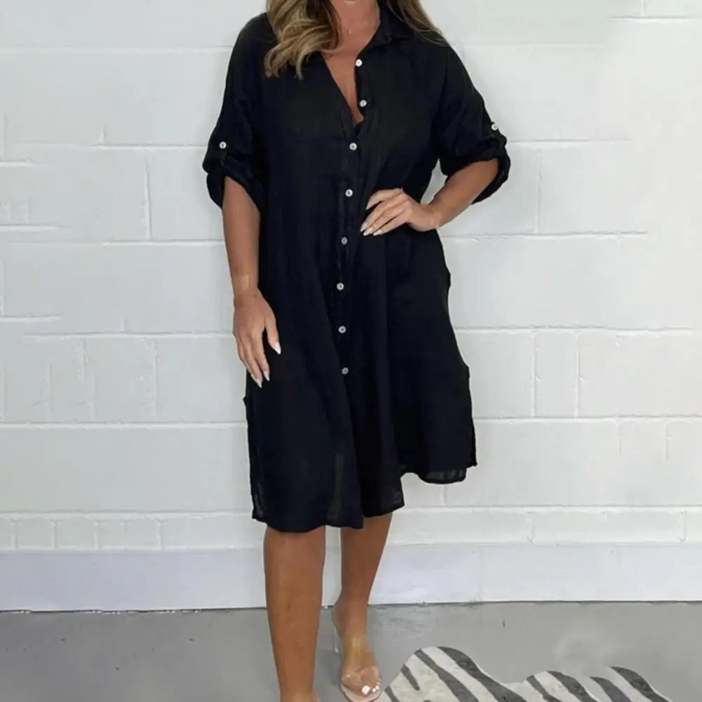 Women's black button-front shirt dress with short sleeves and side slit