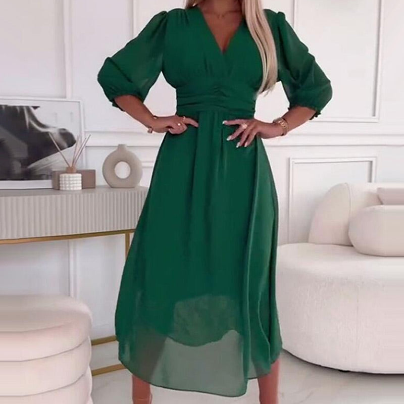 Green V-neck midi dress with puff sleeves and gathered waist