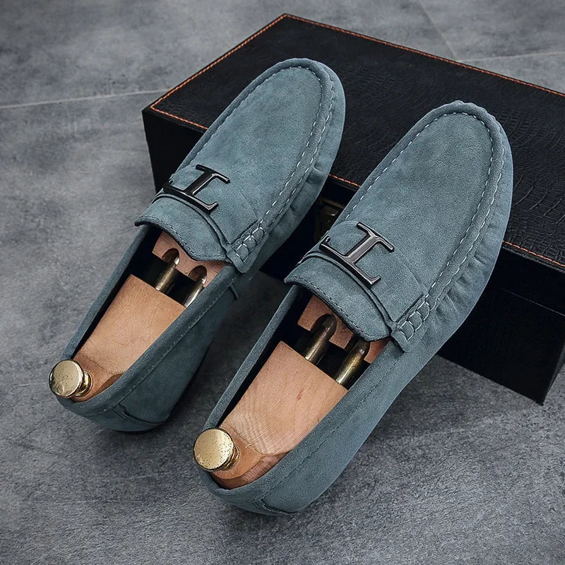 Light blue suede slip-on instapper loafers with H buckle strap