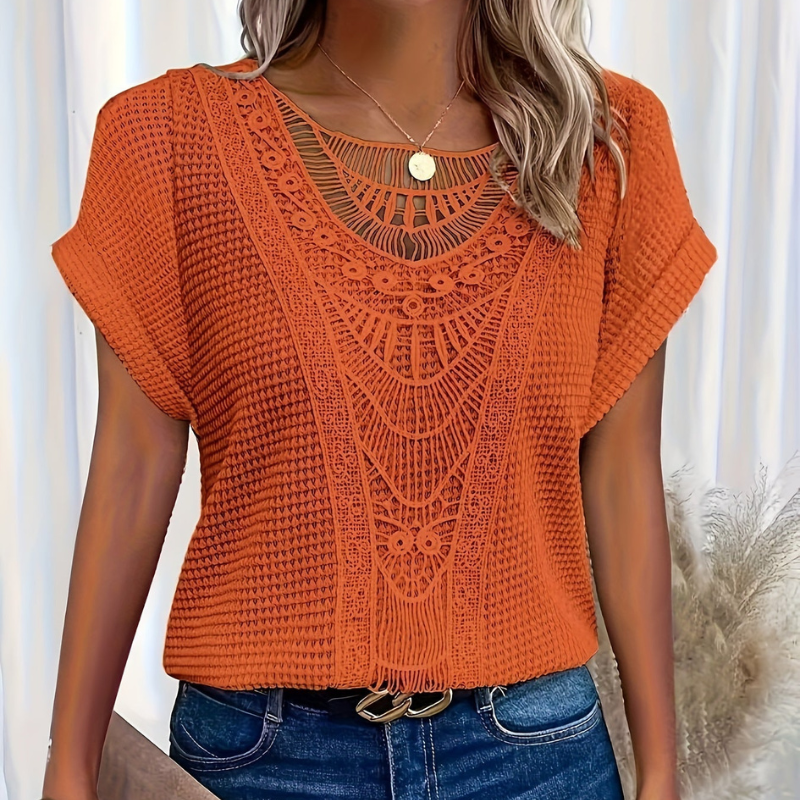 Elegant top in orange with lace-look yoke, short sleeves, round neckline button