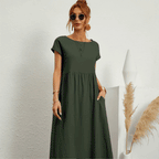 Ruby summer dress in dark green, tiered midi with short sleeves and scoop neckline