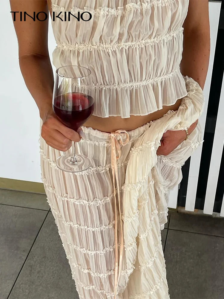 White tiered halter top and maxi skirt set with gathered ruffle layers