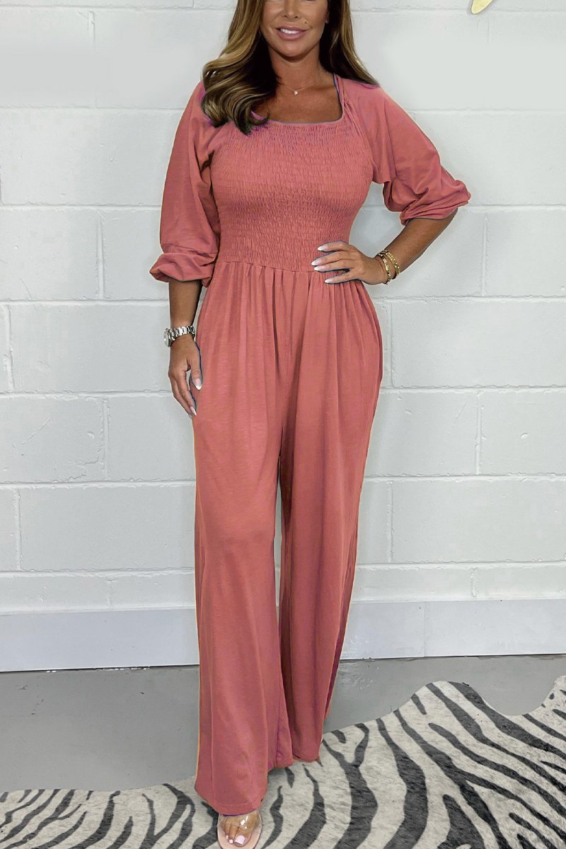 Dusty rose square-neck jumpsuit set with elbow puff sleeves and wide-leg pants.