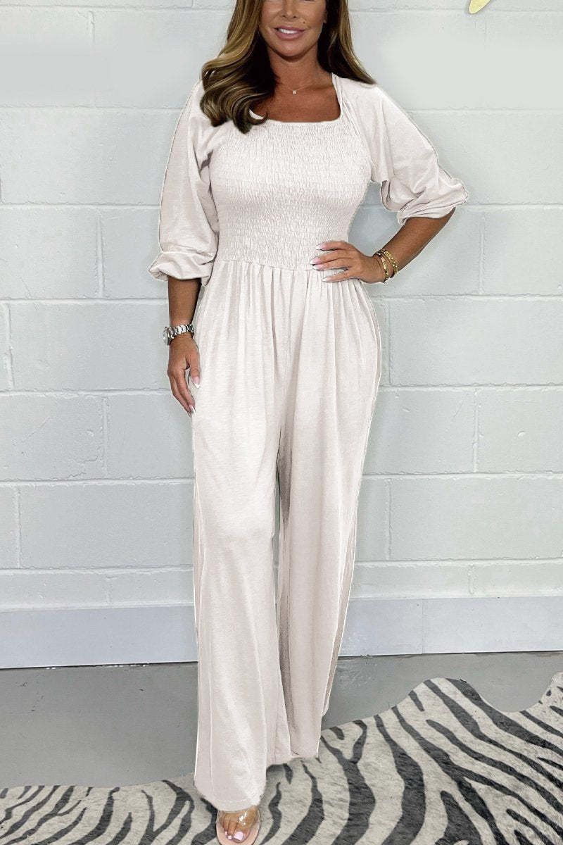 White square-neck jumpsuit set with elbow puff sleeves and wide-leg pants.