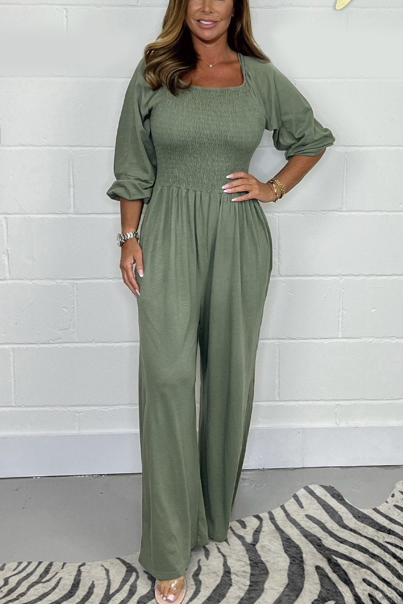 Green square-neck jumpsuit set with elbow puff sleeves and wide-leg pants.
