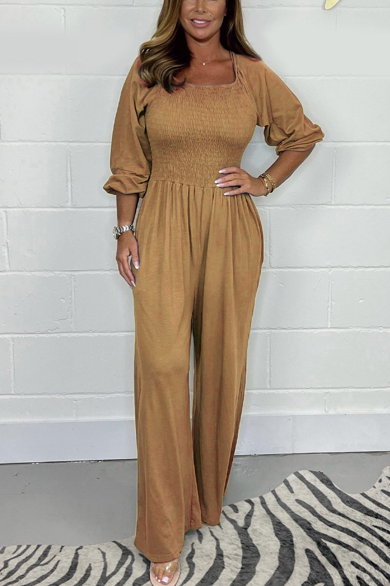 Rust brown square-neck jumpsuit set with elbow puff sleeves and wide-leg pants.