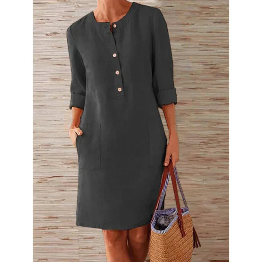 Black button-front summer dress with three-quarter sleeves and side pockets