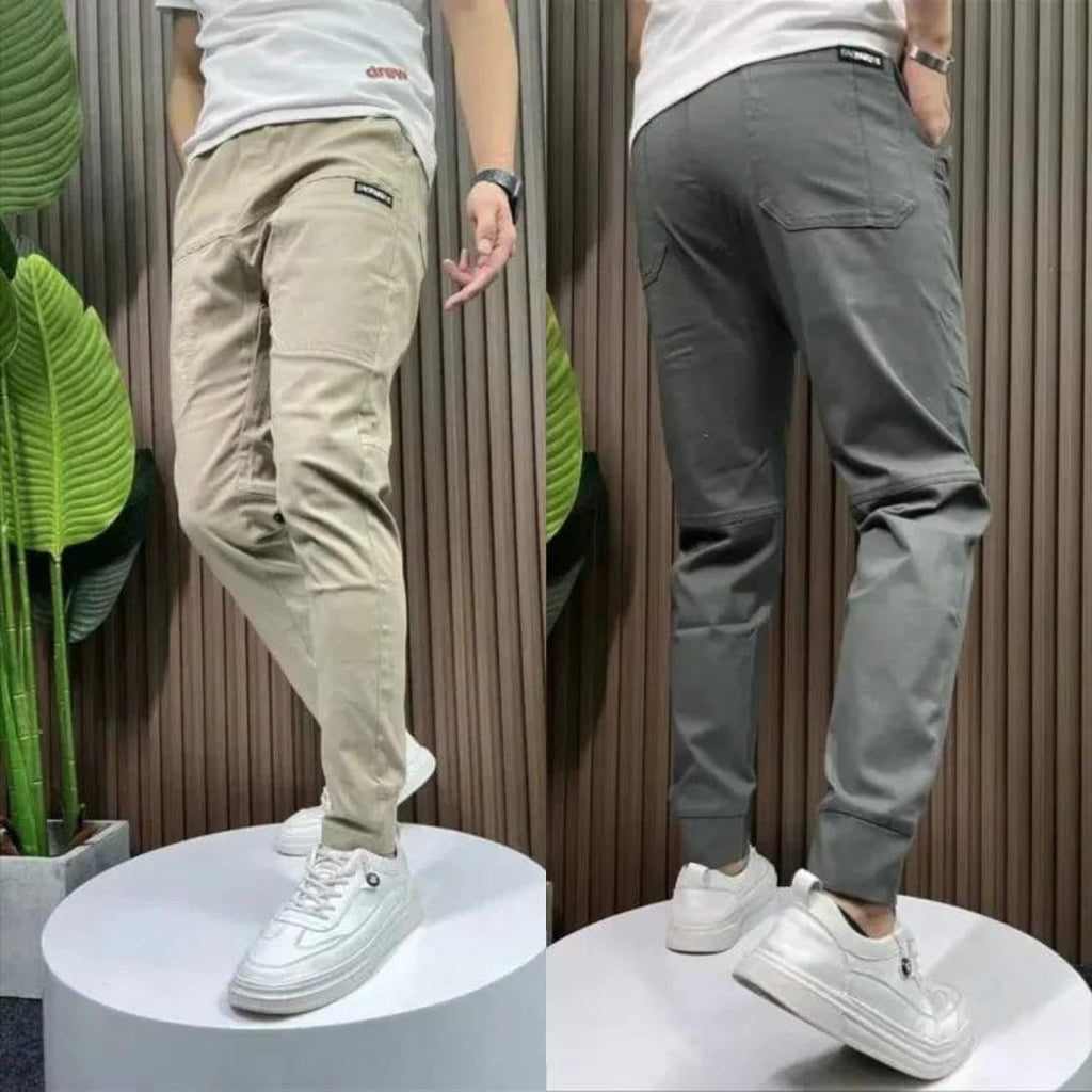 Men's beige casual pants with zip fly, tapered legs, side pockets