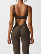 Black sports jumpsuit with open-back cutout and racerback-style sports bra top