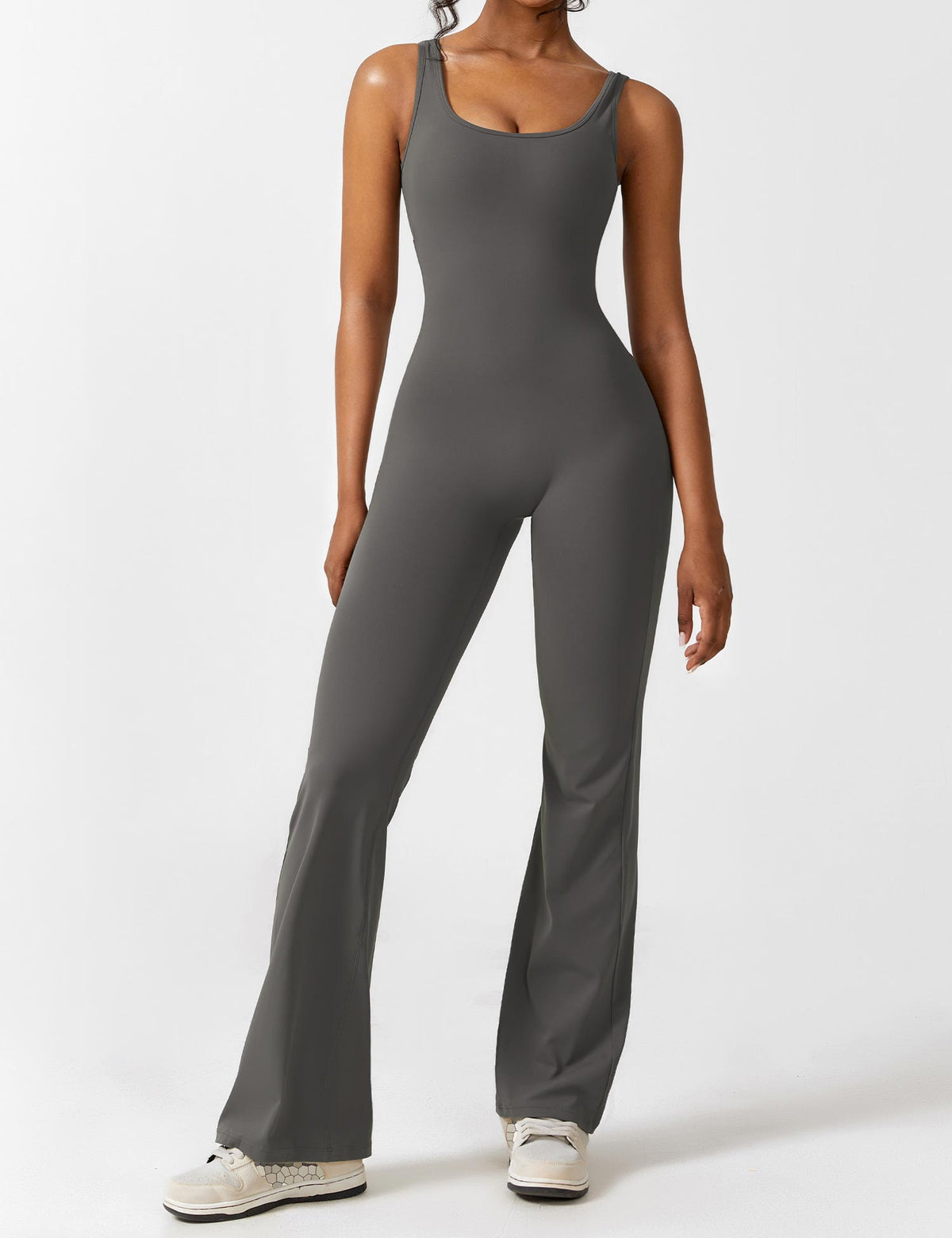 Athletic dark gray jumpsuit with wide-leg flares and scoop neckline at front.
