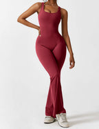 Athletic maroon jumpsuit with scoop front neckline and flared bell-leg pants.