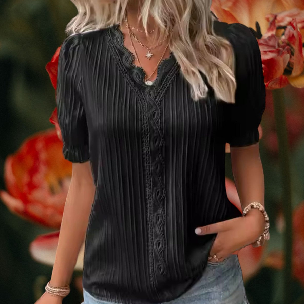 Black embroidered V-neck blouse with vertical stripes and puff short sleeves